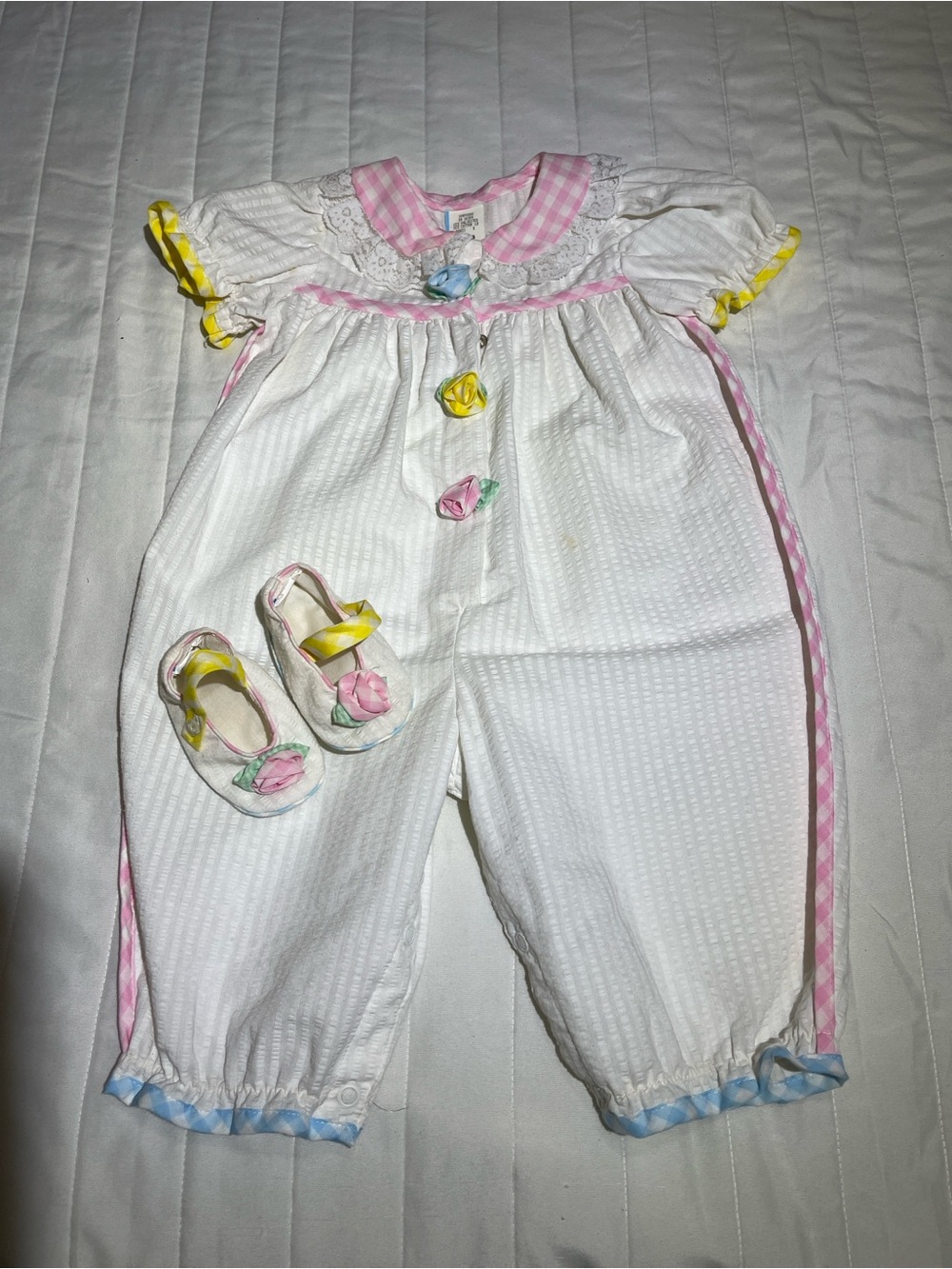 White Baby One-Piece Bodysuit with Pink Trim and Floral Accents